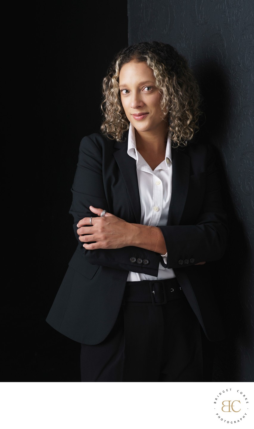 Professional Portrait of a Woman in a Black Suit