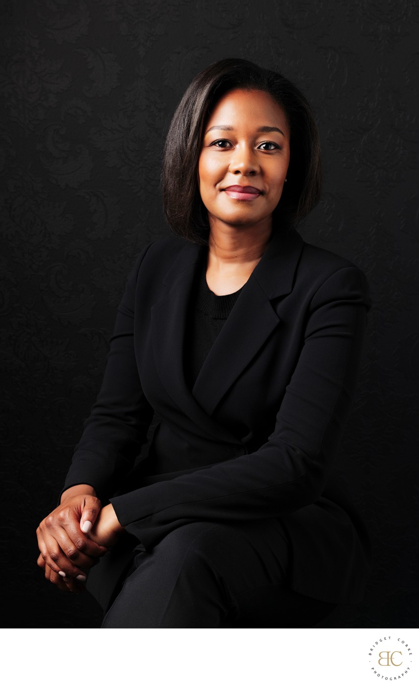 Confident Businesswoman in Black Suit Portrait