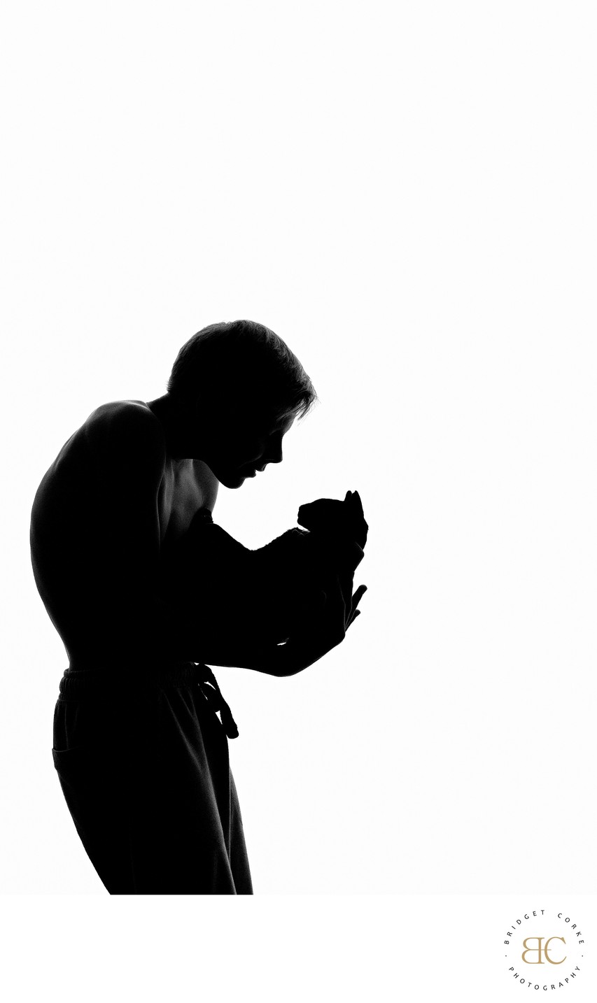 Silhouette of a Tender Moment with a Cat