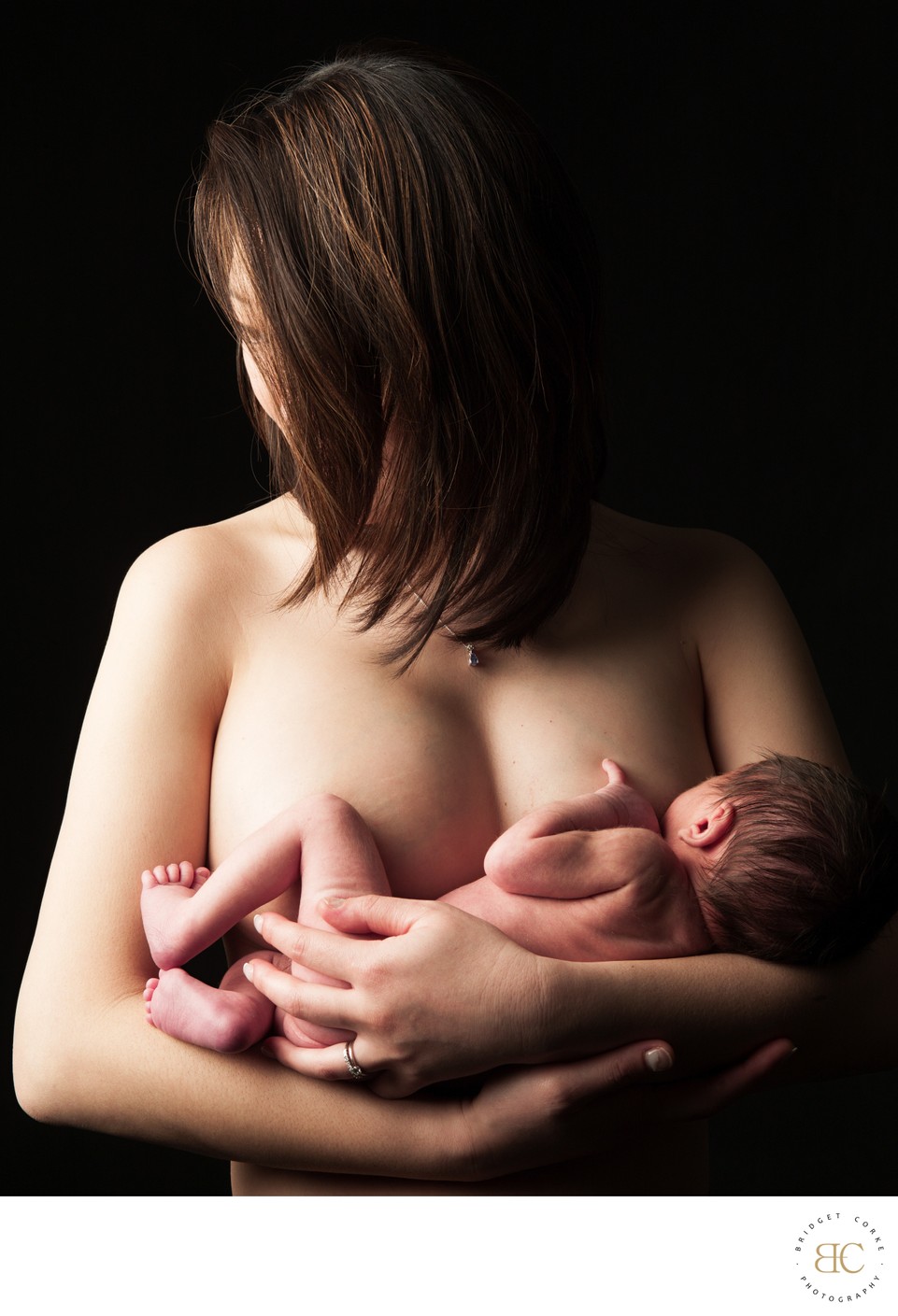 Intimate Maternal Bond: Mother Holding Newborn