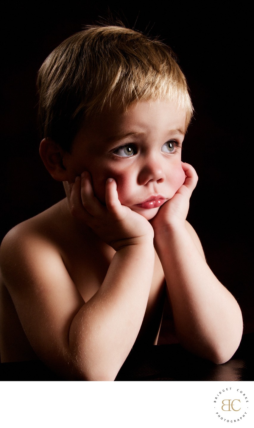 Reflective Moment: Award-Winning Young Boy Portrait 