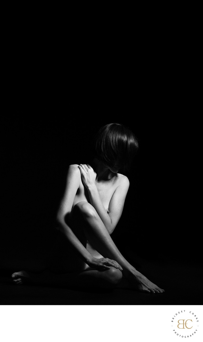 Vulnerability in Shadows: Intimate Pose