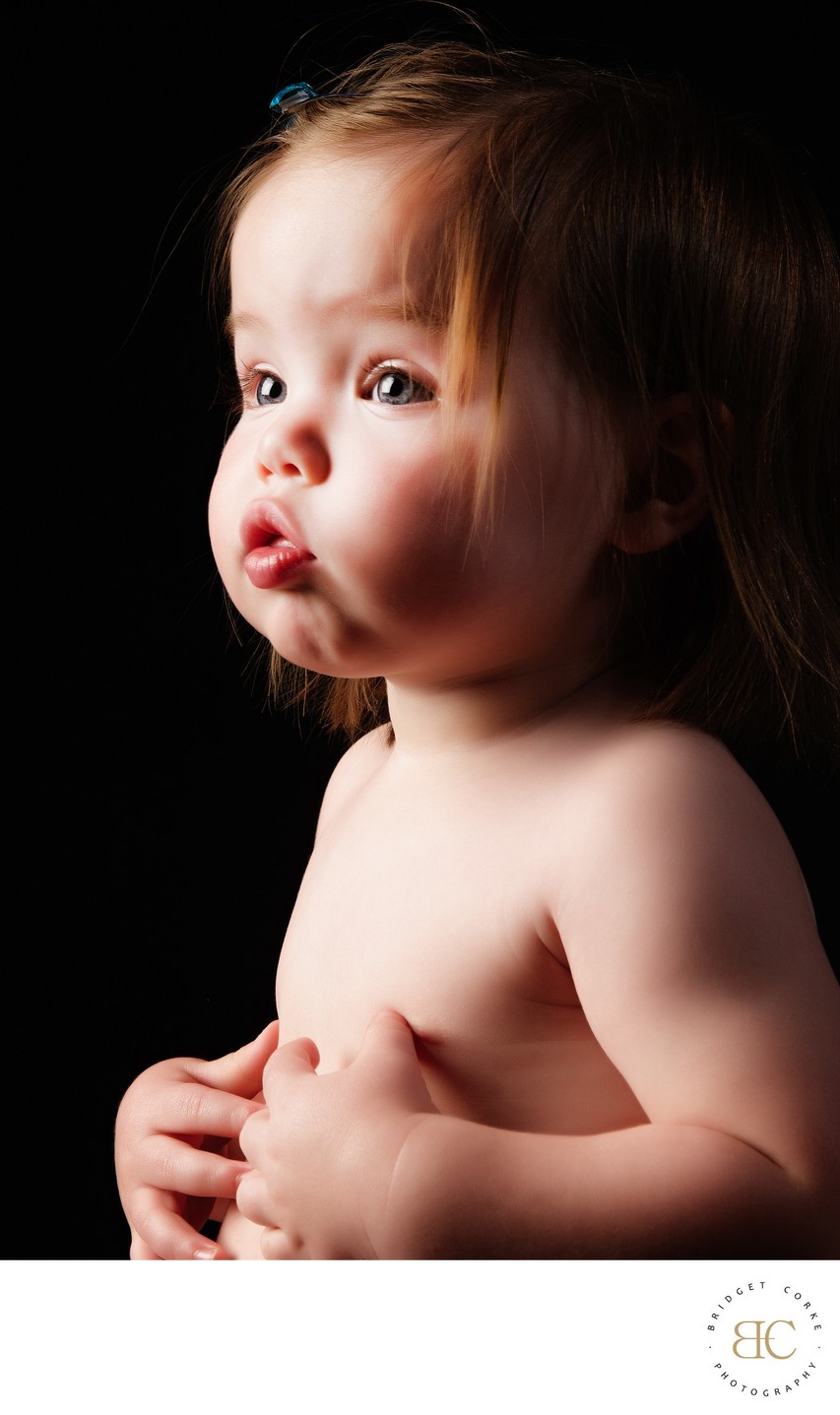 Pensive Beauty: Toddler’s Thoughtful Gaze