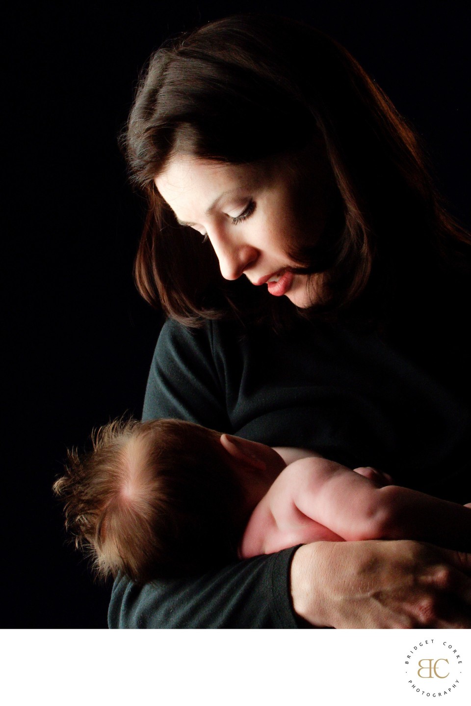 Newborn Held in Mother's Loving Gaze