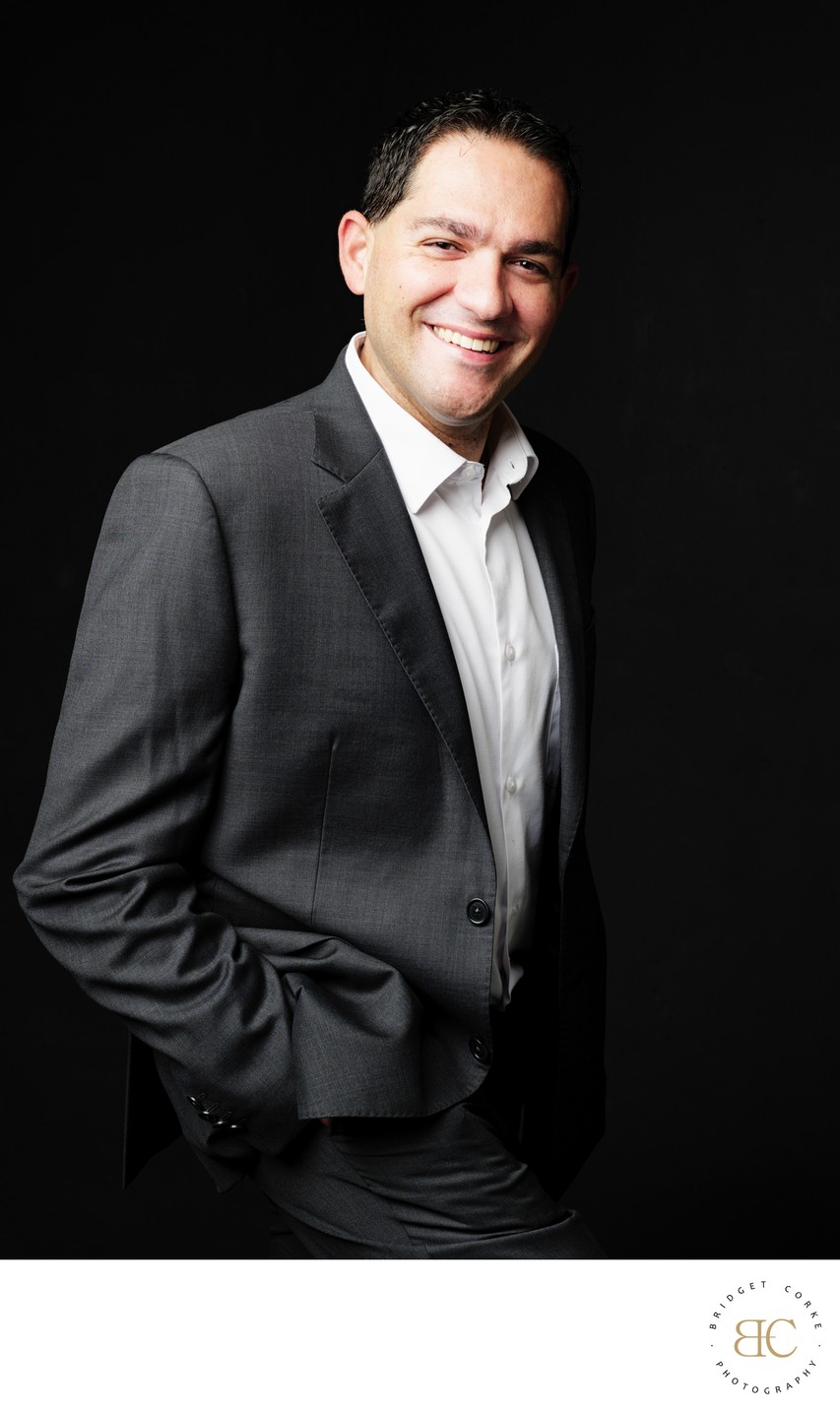 Confident Headshot in Grey Suit with Natural Smile