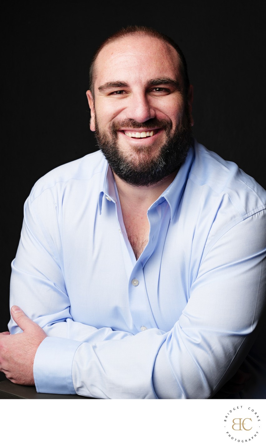 Confident Businessman in Light Blue Shirt