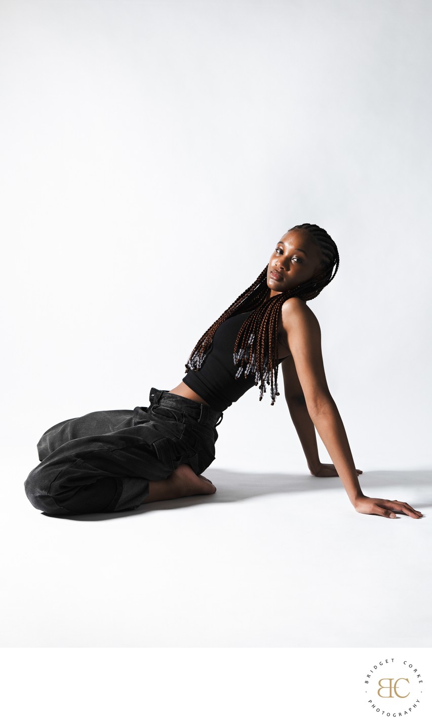 Studio Portrait Reclining in Black Tank Top and Jeans