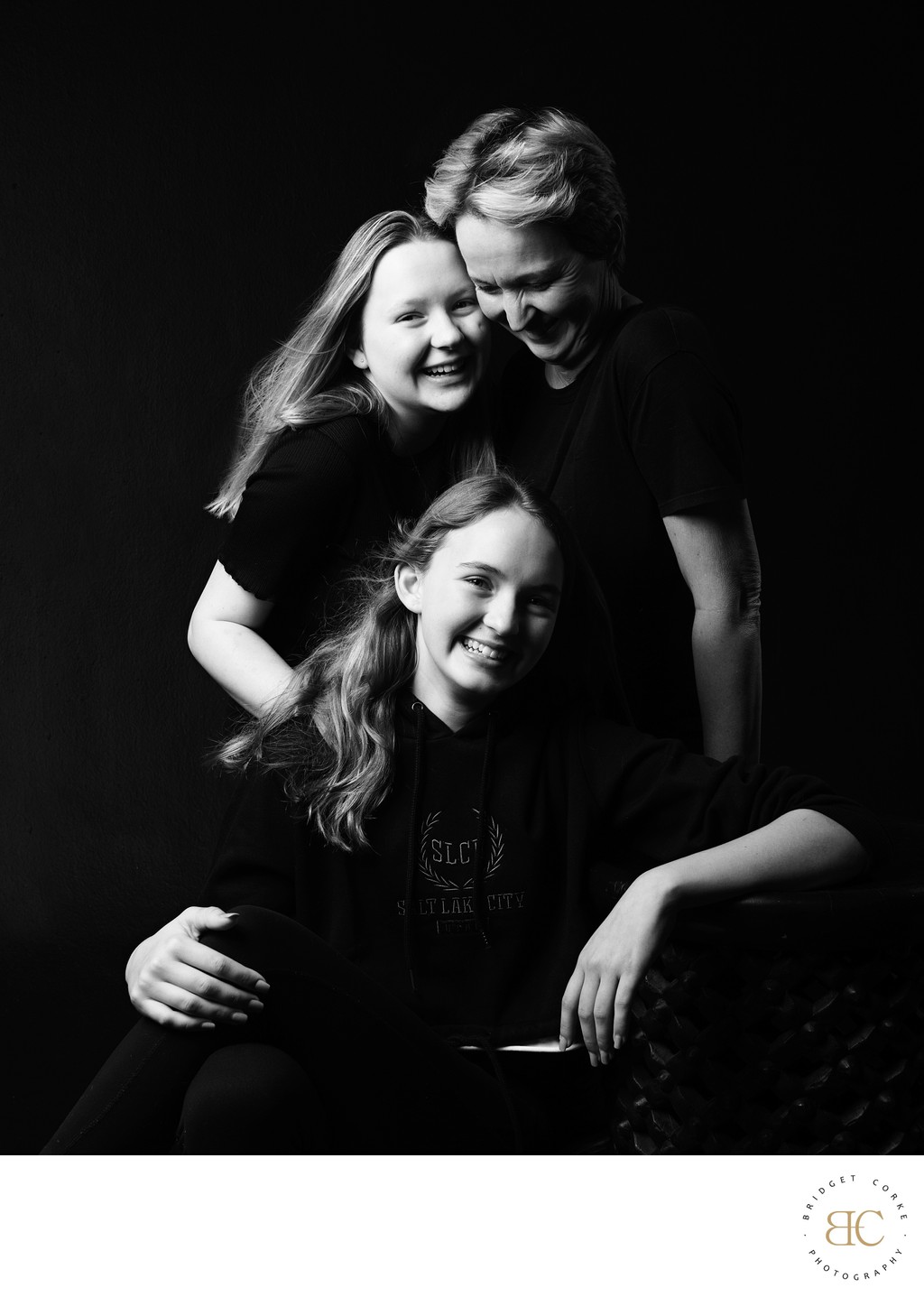 Joyful Mother and Daughters Black and White Portrait