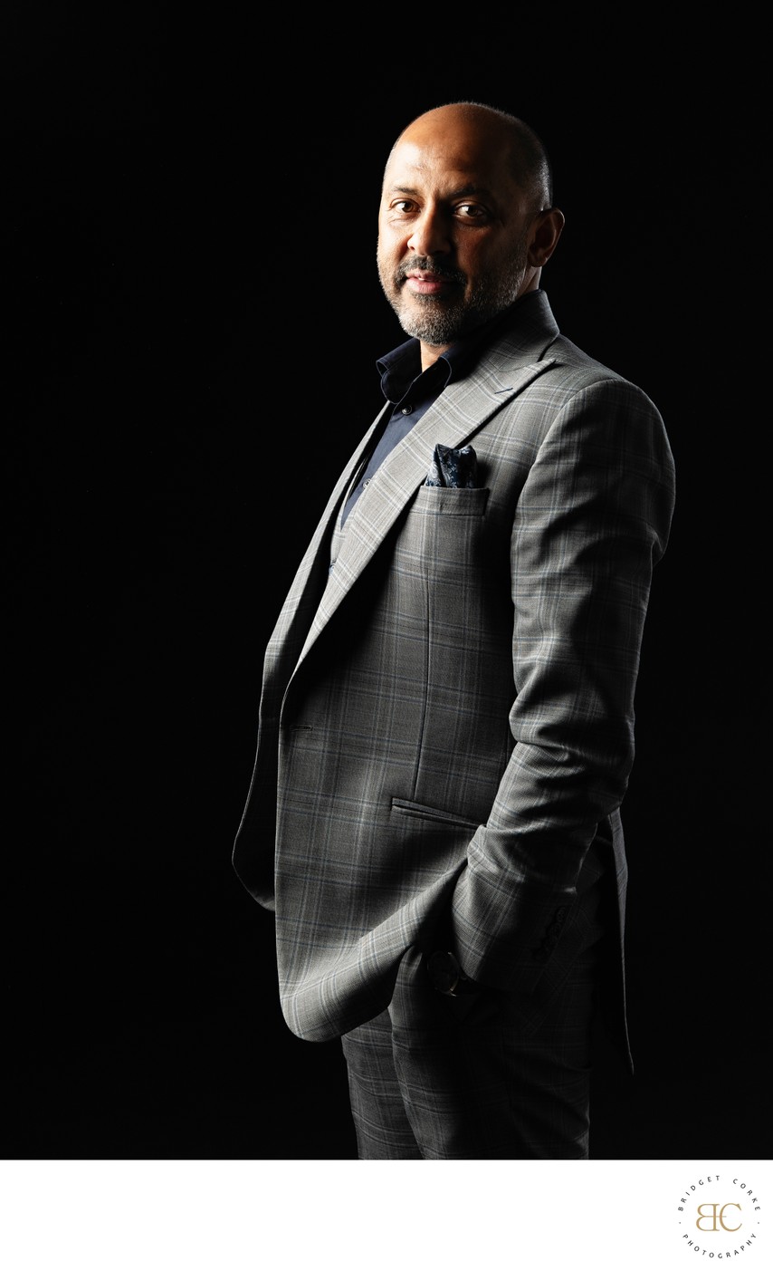 Executive portrait of a man in a grey suit