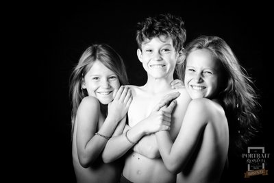 Smiling Shirtless Siblings