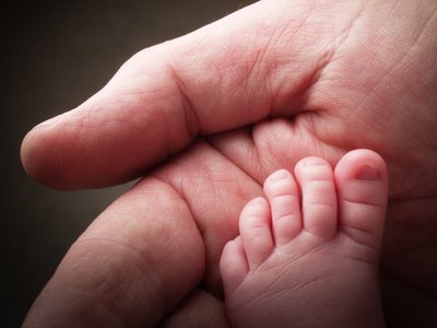 Newborn Foot Palm Dad's Hand