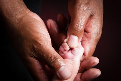 Newborn & Dad's Hands Comparison