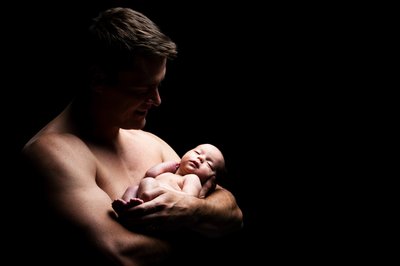 Newborn In Dad's Arms