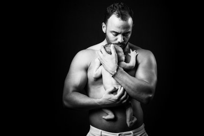 Father Holding Newborn
