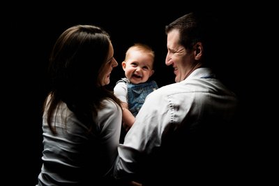 Smiling Baby Posing With Parents