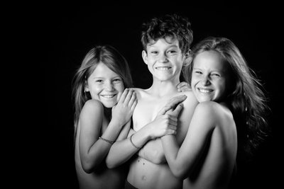 Smiling Shirtless Siblings