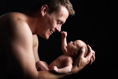 Newborn Staring At Dad