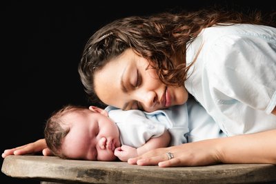 Sleeping Newborn WIth Mother