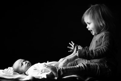 Excited Toddler WIth Newborn Sister