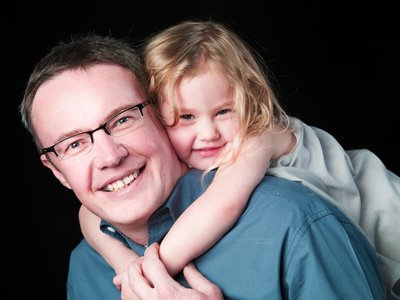 Daughter Hanging Dad Back