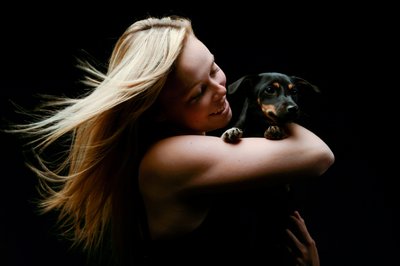 Dachshund On Girls Arm