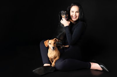 Black And Gold Dachshund With Woman