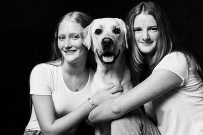 Golden Labrador With Teen Girls