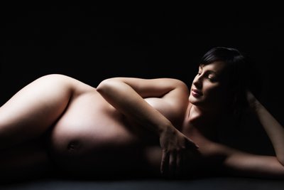 Elegant Maternity Portrait in Dramatic Lighting