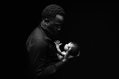 Father’s Whisper: Tender Newborn Connection