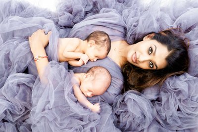 Twins Embrace: Mother & Newborns in Purple Tulle