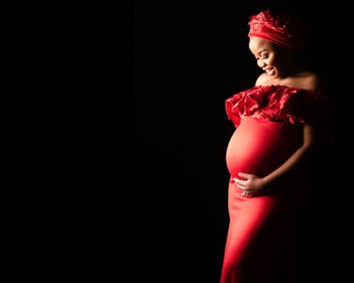 Radiant Maternity Portrait in Red Gown