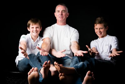 Father and Barefoot Son's Playful Portrait