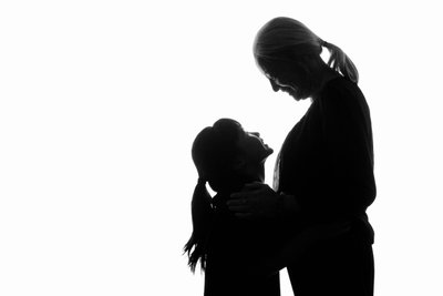 Grandmother and Grandaughter Silhouette Embrace