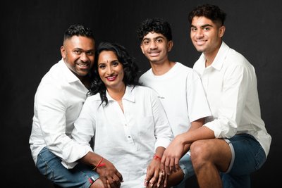 Cheerful Family Portrait in Matching White Outfits