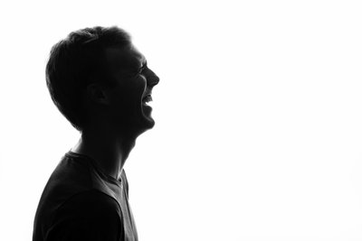 Silhouette of a Man Laughing in Profile