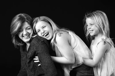 Playful Mother and Daughters Black-and-White Portrait