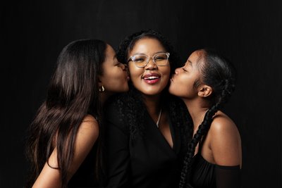 Playful Mother and Daughters Studio Portrait