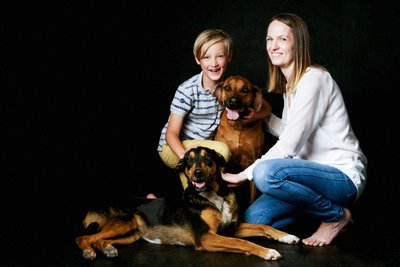 Joyful Family Portrait with Dogs