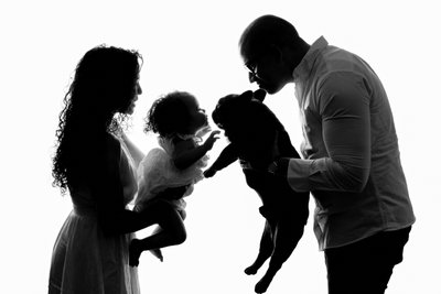 Family Silhouette with Baby and Dog