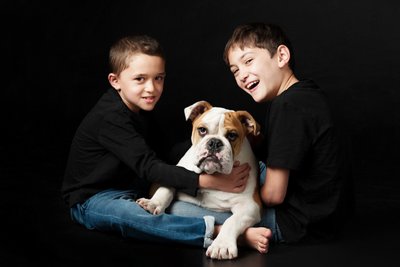 Playful Portrait of Two Boys and a Bulldog