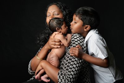 Sibling's First Kiss to Newborn Brother