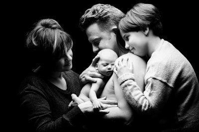 Family Adoration: Newborn Embraced by All