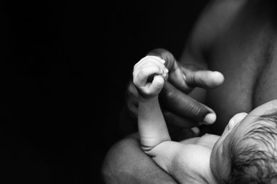 Father And Newborn Hand Detail Portrait