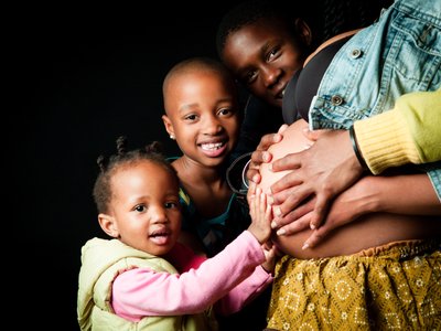 Siblings Sharing Love with Mother’s Baby Bump