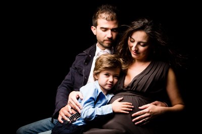 Family Embrace in Maternity Portrait with Young Child