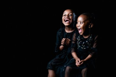 Joyful Moment: Award-Winning Sisters Sharing Laughter