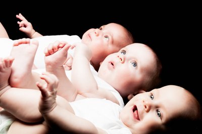 A trio of Joy: Captivating Baby Glances