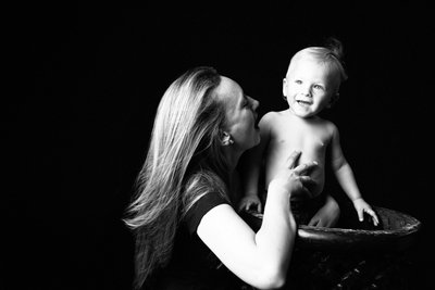 Playful Mum and Baby Son in Studio Light