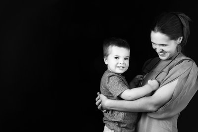 Mum Holding Son in a Quiet, Joyful Moment