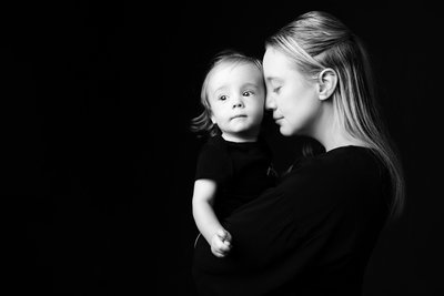 Mother Holding Son in Quiet Black and White